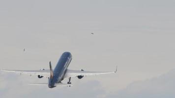 NOVOSIBIRSK, RUSSIAN FEDERATION JULY 15, 2022 - Plane of Azur Air with Lujo Art Joy Livery departure, fly away, rear view. Tourism and travel concept video