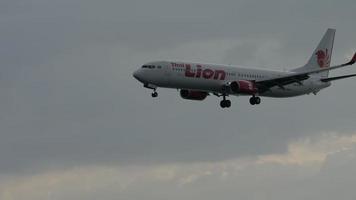 PHUKET, THAILAND NOVEMBER 29, 2019 - Boeing 737 9GPER, HS LTK of Thai Lion Air flies, descending to land at Phuket airport. Tourism and travel concept video