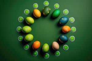 Creative Easter layout of colorful eggs on a green background, . photo