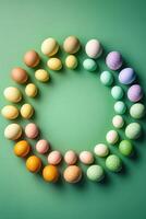 Creative Easter layout of colorful eggs on a green background, . photo