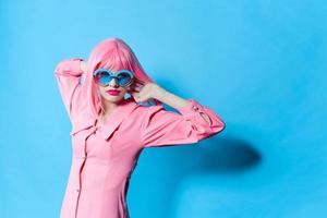 fashionable woman in pink wig pink dress Red lips isolated background photo