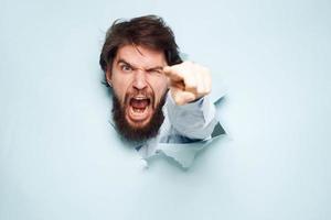 Angry man gestures with his hands dissatisfaction emotions work office photo