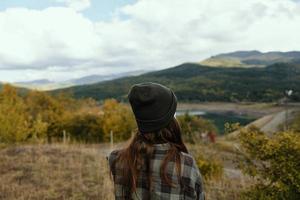 Woman on a meadow in the mountains dry grass nature fresh air photo