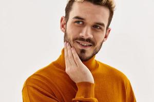 Cheerful man holding hand on face cropped view glamor close-up photo