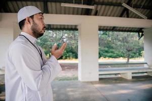 Asian islam man prayer,Young Muslim praying,Ramadan festival concept photo