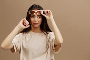 Brunette attractive look charmin dark glasses in a t-shirt isolated background photo