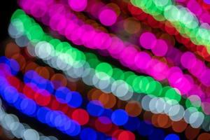 Colorful bokeh glitter defocused lights abstract background. photo