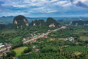 Aerial top view of mountains and palm tree with dramatic sky photo