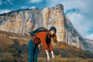 woman tourist with backpack on nature autumn season travel photo