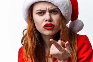 woman wearing santa hat holiday christmas fashion posing photo