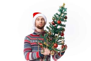 Cheerful man in New Year's clothes decoration christmas isolated background photo