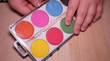 Gouache palette of eight colors close-up video