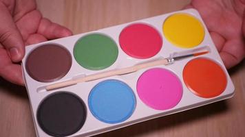 Gouache palette of eight colors close-up video