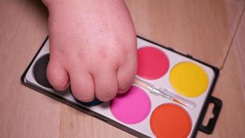 Gouache palette of eight colors close-up video