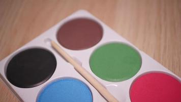 Gouache palette of eight colors close-up video
