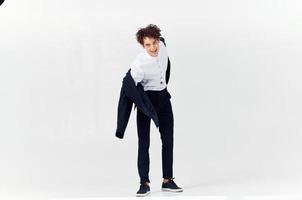 man curly hair suit modern style fashion posing photo