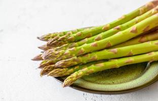 Fresh asparagus on the plate photo