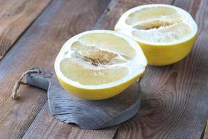 Pomelo on the wooden board photo