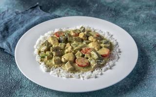 Thai green chicken curry with rice photo