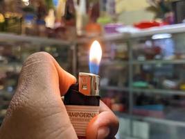 A close up of burning gas lighter photo