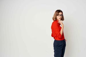 woman in red shirt posing fashion official light background photo