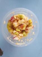 RUJAK BEBEG is a paste with various kinds of fruit pounded with spicy chili sauce photo