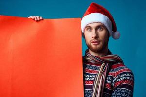 Cheerful man in a christmas Orange mockup Poster studio posing photo