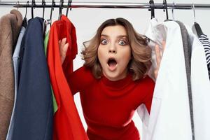 pretty woman trying on clothes shop shopaholic isolated background photo