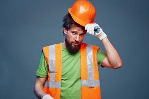 Emotional builder working uniform orange helmet safety Construction professional photo