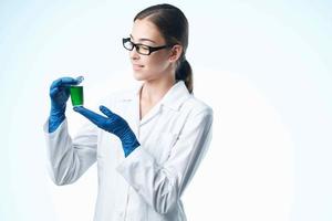 laboratory assistant in white coat chemical solution analyzes professional science photo