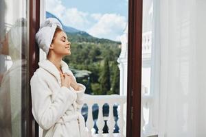 Portrait woman posing against the backdrop of mountains on the balcony architecture Lifestyle photo