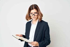 cheerful woman call note in hands professional official work photo