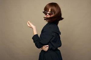 Luxurious woman classic coat good mood posing studio photo