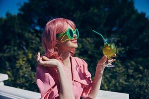 cheerful woman green glasses glamor cocktail fun Relaxation concept photo