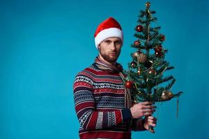Cheerful man in New Year's clothes advertising copy space studio posing photo