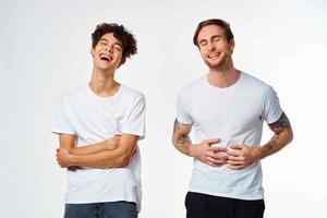 two friends in white t-shirts communication emotions together photo