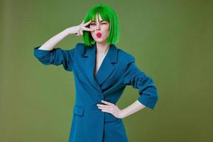 Pretty young female fun gesture hands green hair fashion color background unaltered photo