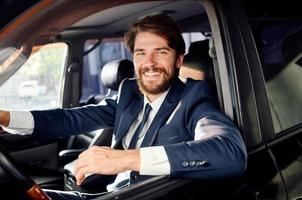 emotional man Driving a car trip luxury lifestyle success photo
