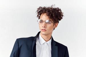 cute guy in a suit curly hair glasses fashion photo