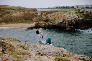 woman sweaters cloudy sea admiring nature Lifestyle photo