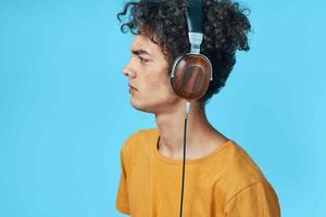 Guy in headphones listening to music technology lifestyle studio photo