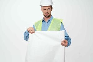 man in white helmet blueprints builder Working profession photo