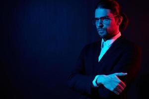 businessmen gestures with his hands with glasses dark background photo