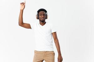 man african appearance in white t-shirt with headphones music modern style photo