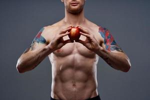 athletic young man with muscular muscles and abs naked torso apple health photo