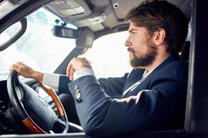 bearded man Driving a car trip luxury lifestyle service photo