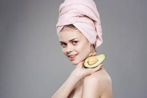 Attractive woman with pink towel on head exotic freshness cropped view photo