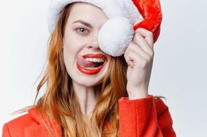 woman in santa hat posing emotions studio christmas photo