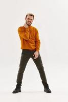 man in brown sweater fashion posing autumn style light background photo