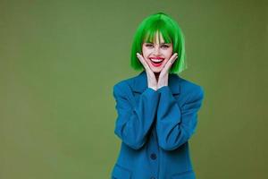 Portrait of a charming lady Glamor green wig red lips blue jacket color background unaltered photo